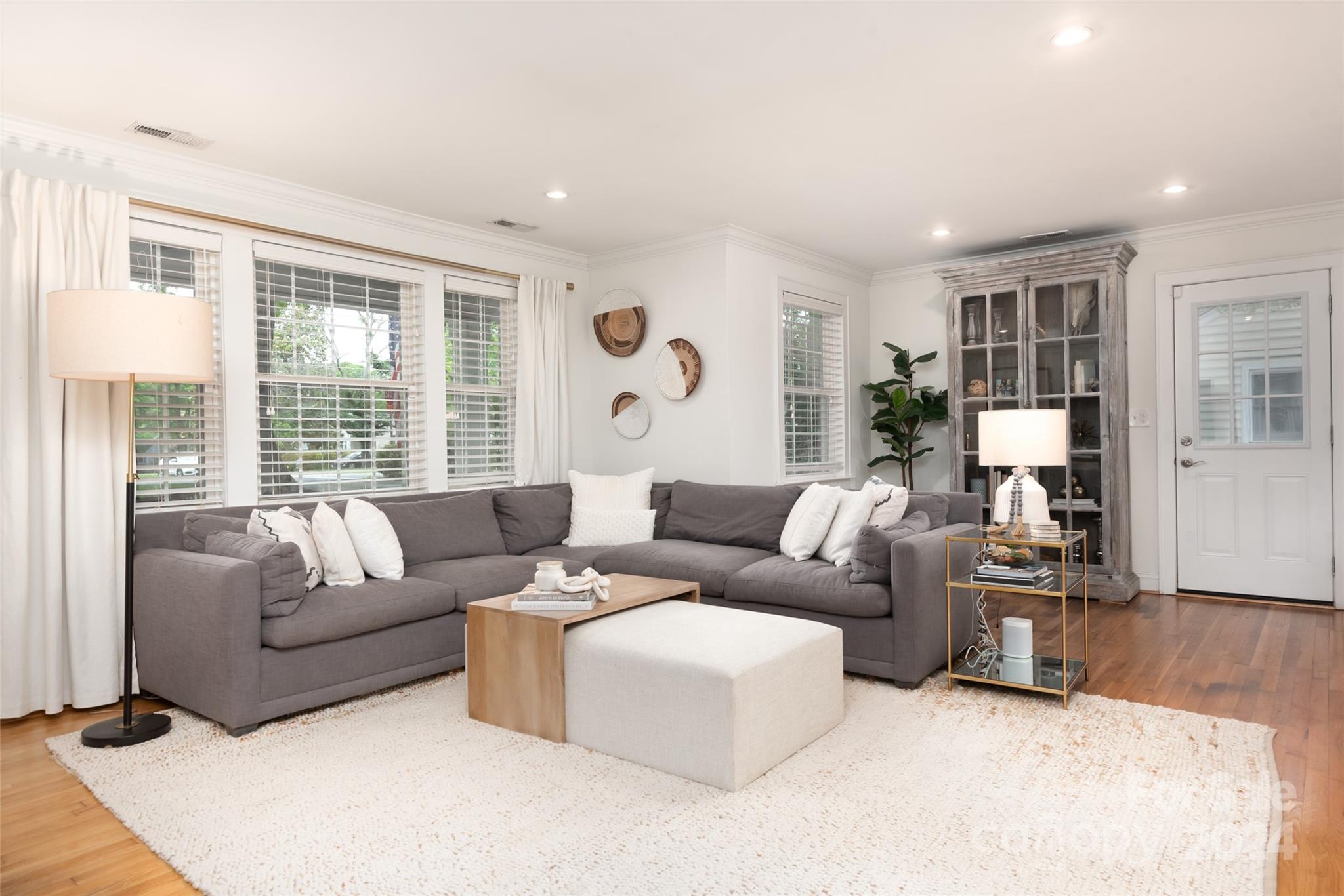 665 Marsh Road Charlotte, NC 28209 - Photo 6 of 31 a living room with furniture and large windows