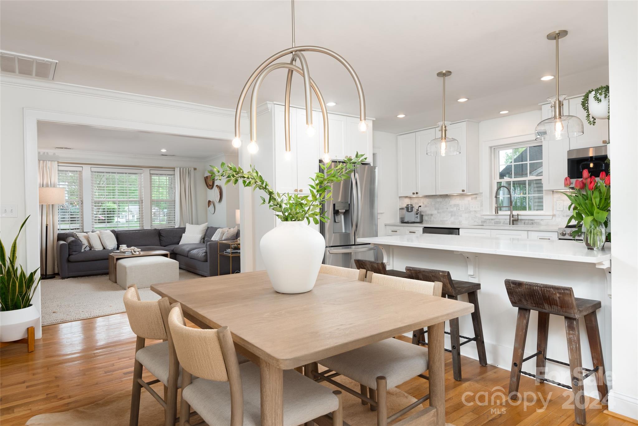 665 Marsh Road Charlotte, NC 28209 - Photo 9 of 31 a view of a dining room with furniture and wooden floor