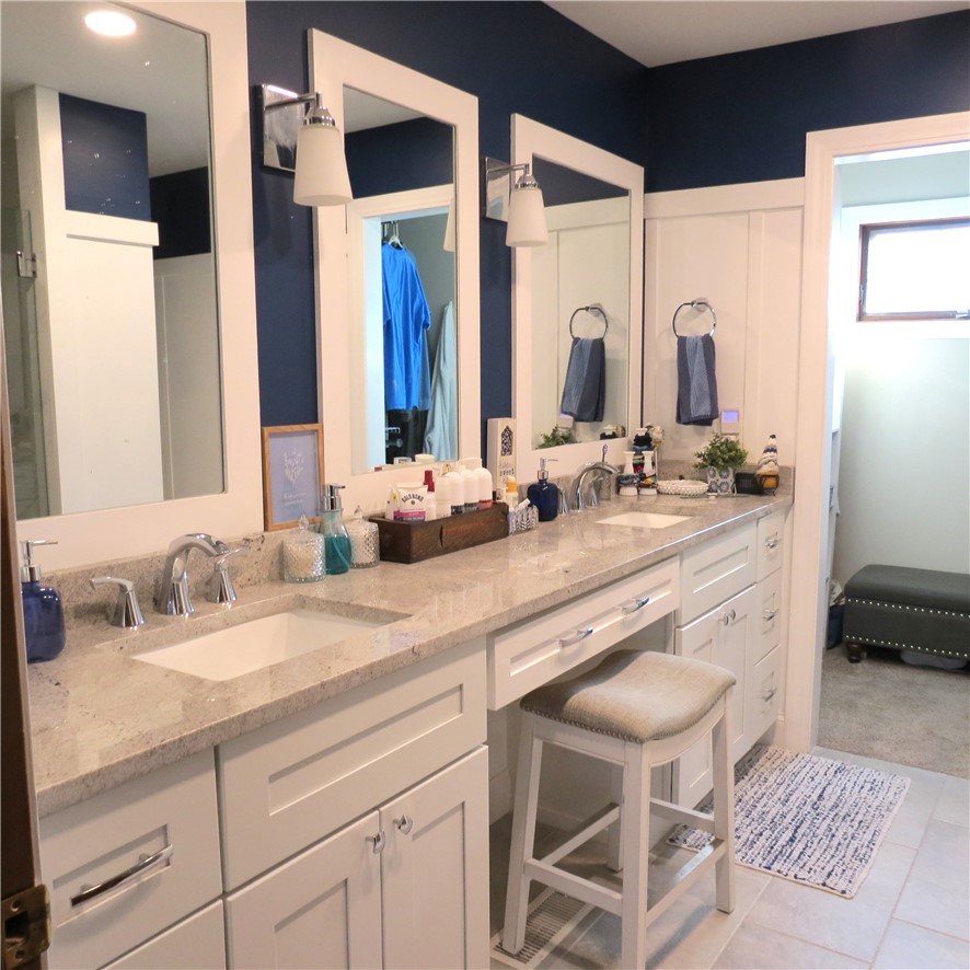10160 Lochard Road Sidney, OH 45365 - Photo 22 of 41 This spacious bathroom offers dual vanities with ample counter space and elegant finishes.
