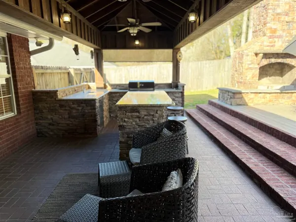 a view of pool with lawn chairs and a yard