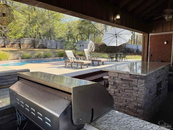 a view of a swimming pool with a patio