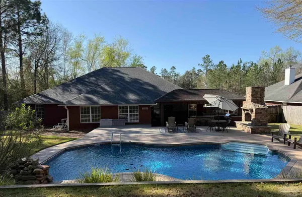a view of a swimming pool with a patio