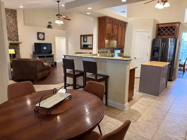 a kitchen with a refrigerator and a sink