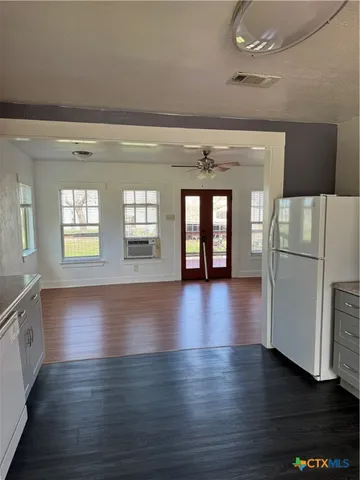 a kitchen with cabinets appliances and a sink