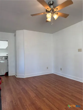 a view of kitchen with wooden floor