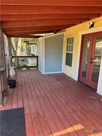 a swimming pool with outdoor seating and yard