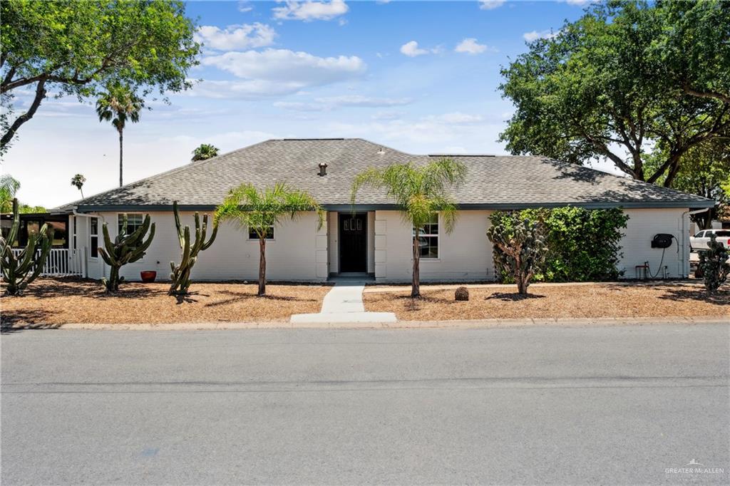 a front view of a house with street space