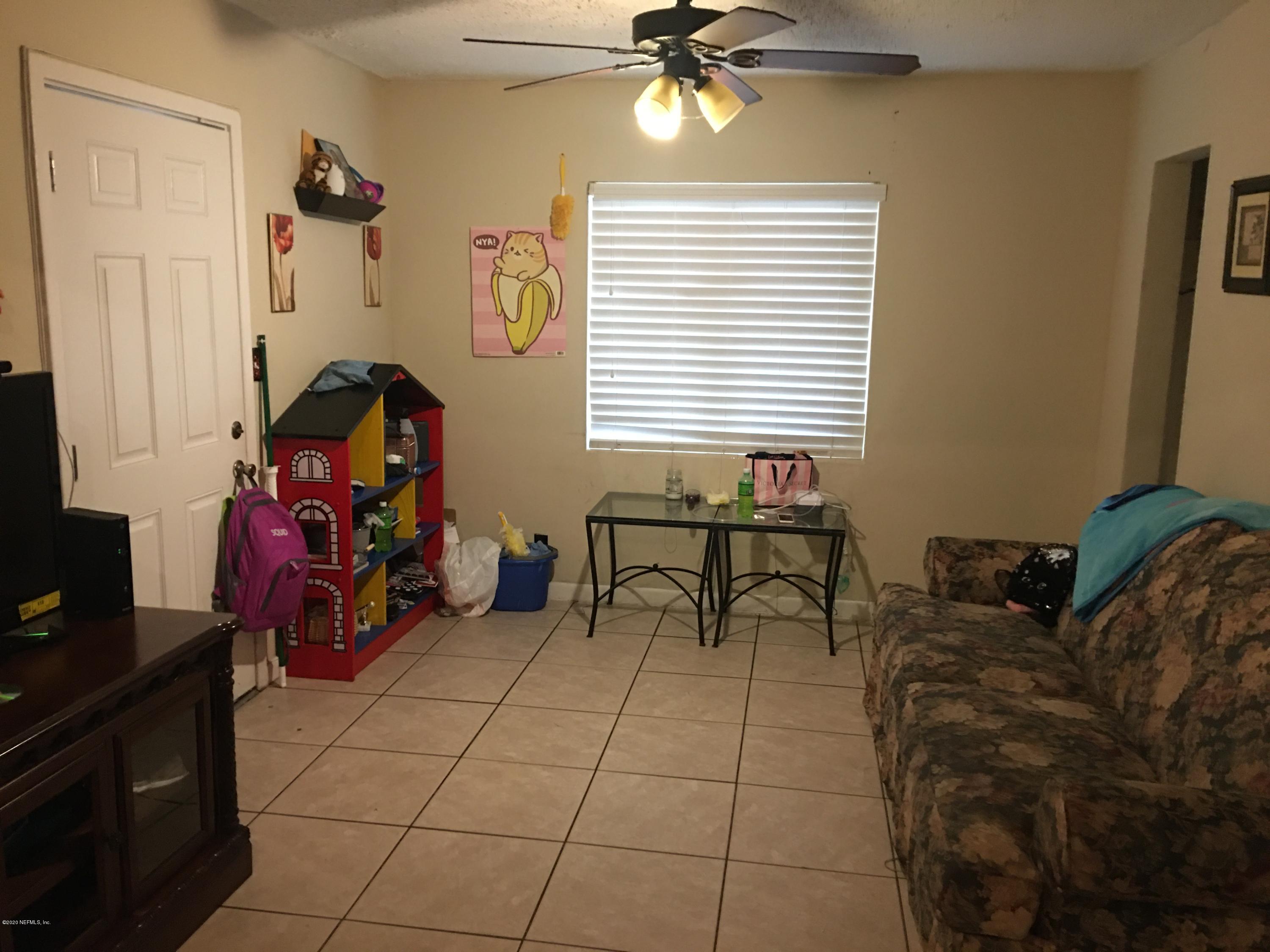 7222 Ridgeway Road North Jacksonville, FL 32244 - Photo 7 of 8 a living room with furniture and a window