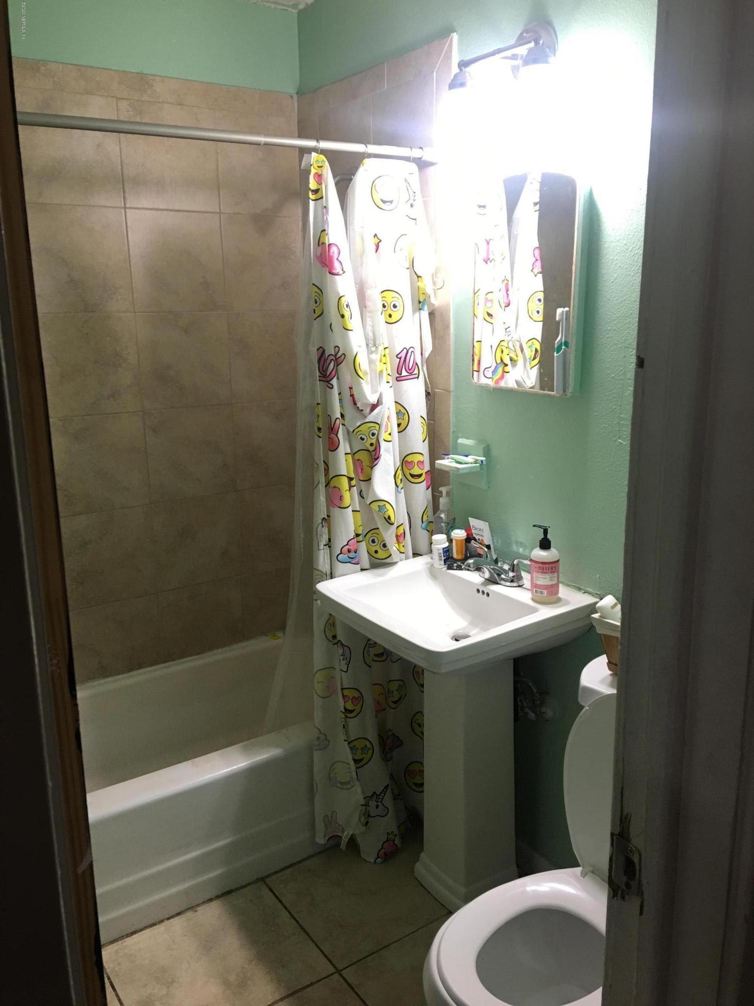 7222 Ridgeway Road North Jacksonville, FL 32244 - Photo 8 of 8 a bathroom with a sink toilet and shower