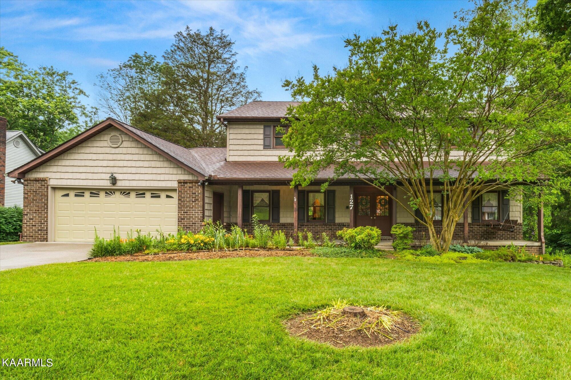 127 Chestnut Hill Road Oak Ridge, TN 37830 - Photo 1 of 45 a front view of a house with garden