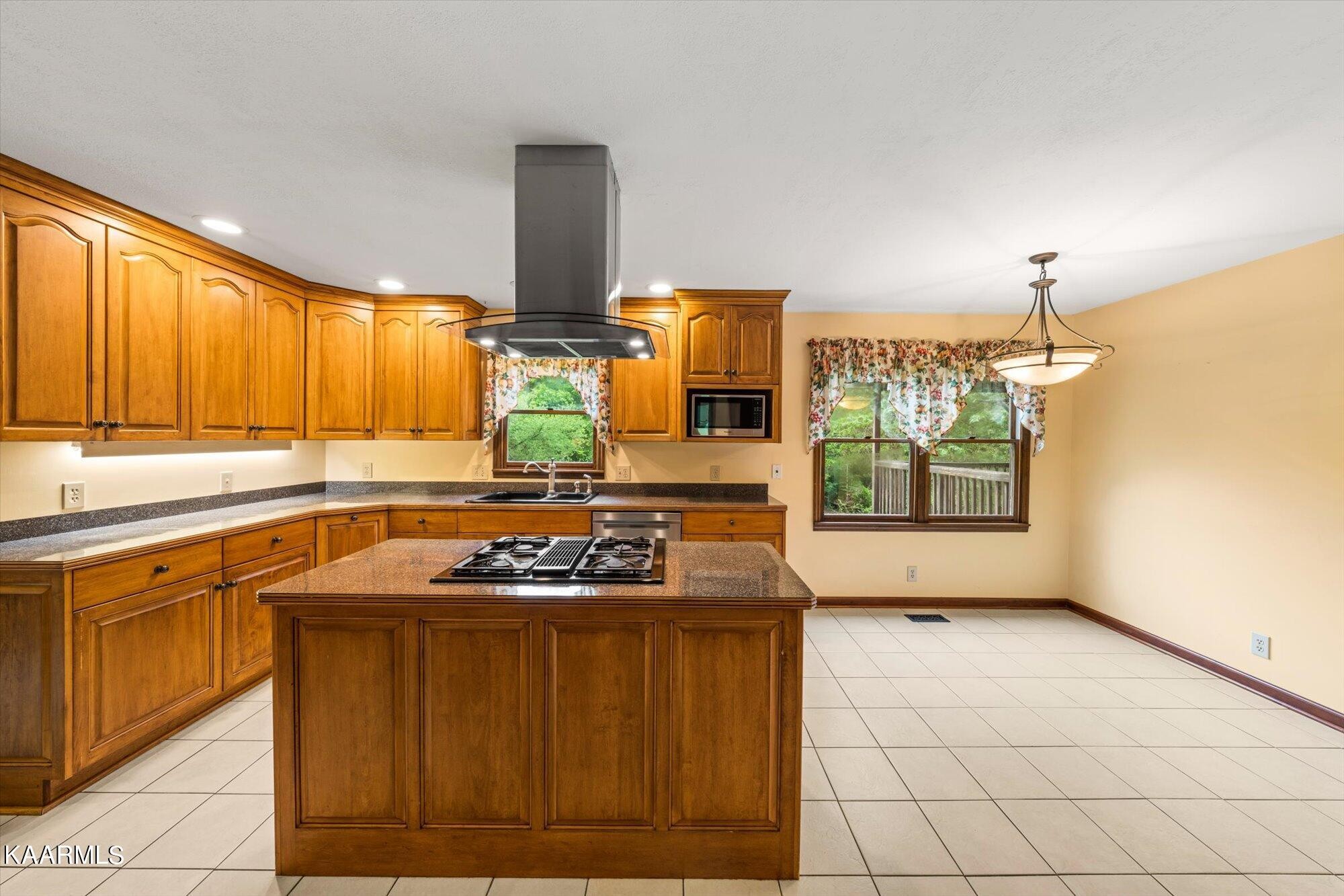 127 Chestnut Hill Road Oak Ridge, TN 37830 - Photo 13 of 45 a kitchen with a stove a sink and a microwave