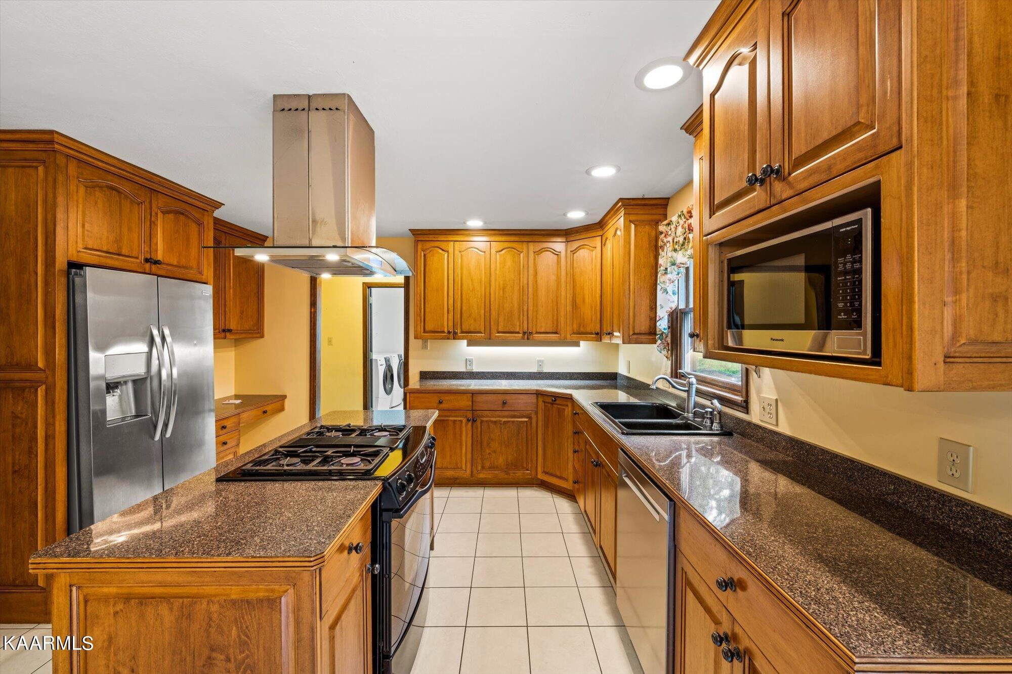 127 Chestnut Hill Road Oak Ridge, TN 37830 - Photo 14 of 45 a kitchen with stainless steel appliances granite countertop a sink a stove and a refrigerator