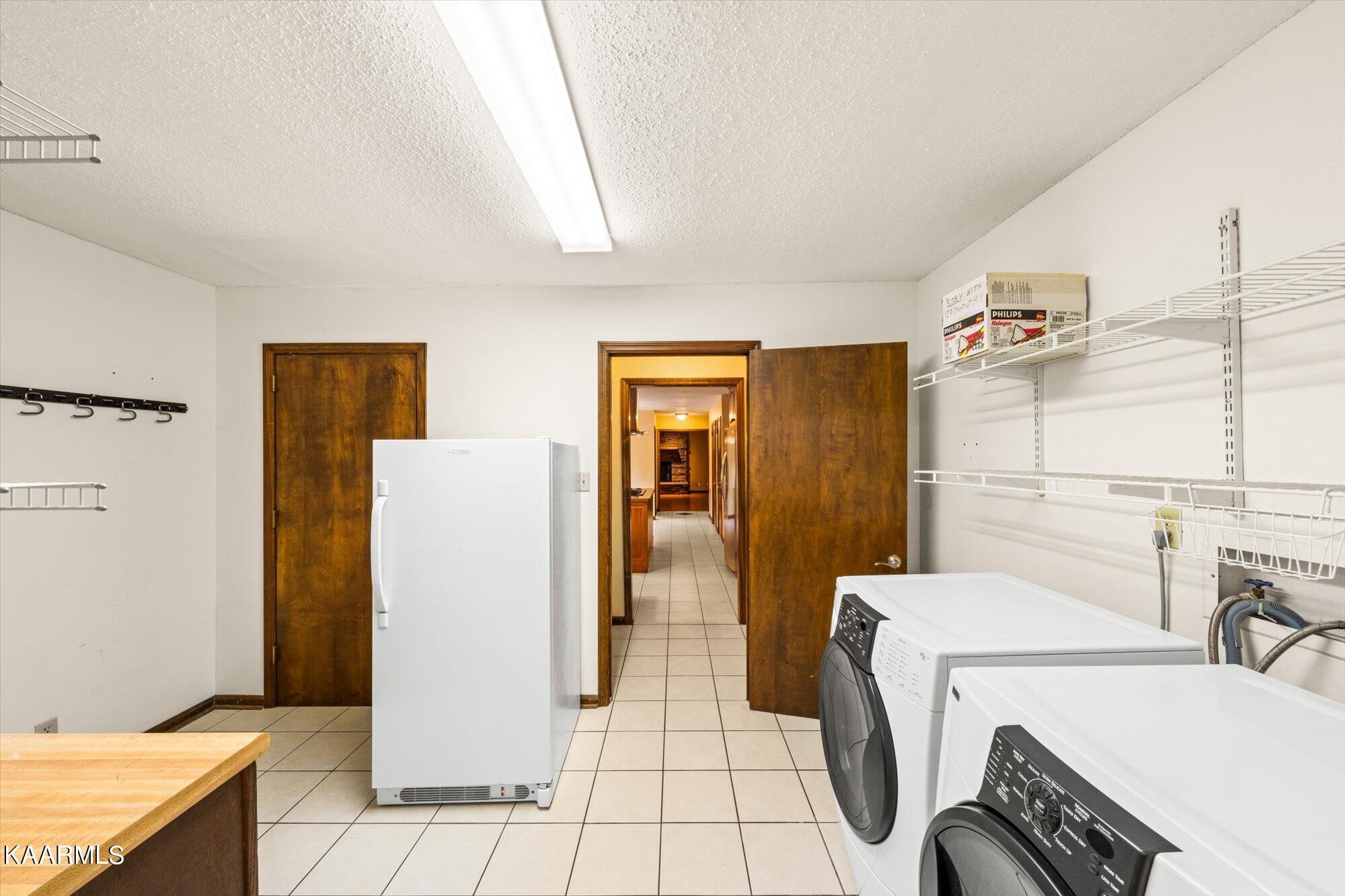 127 Chestnut Hill Road Oak Ridge, TN 37830 - Photo 16 of 45 a utility room with dryer and washer