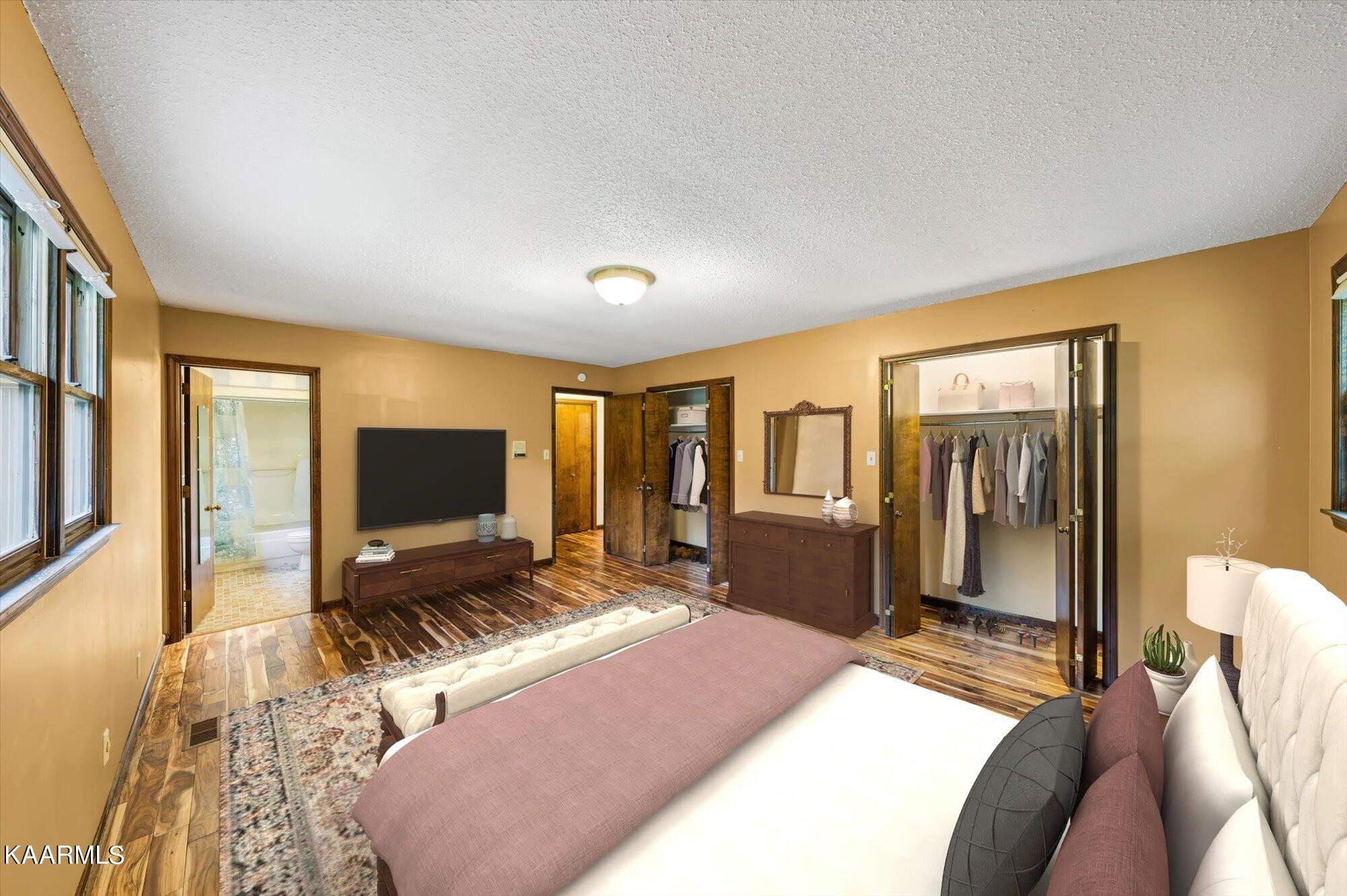 127 Chestnut Hill Road Oak Ridge, TN 37830 - Photo 19 of 45 a bedroom with a bed and a flat screen tv
