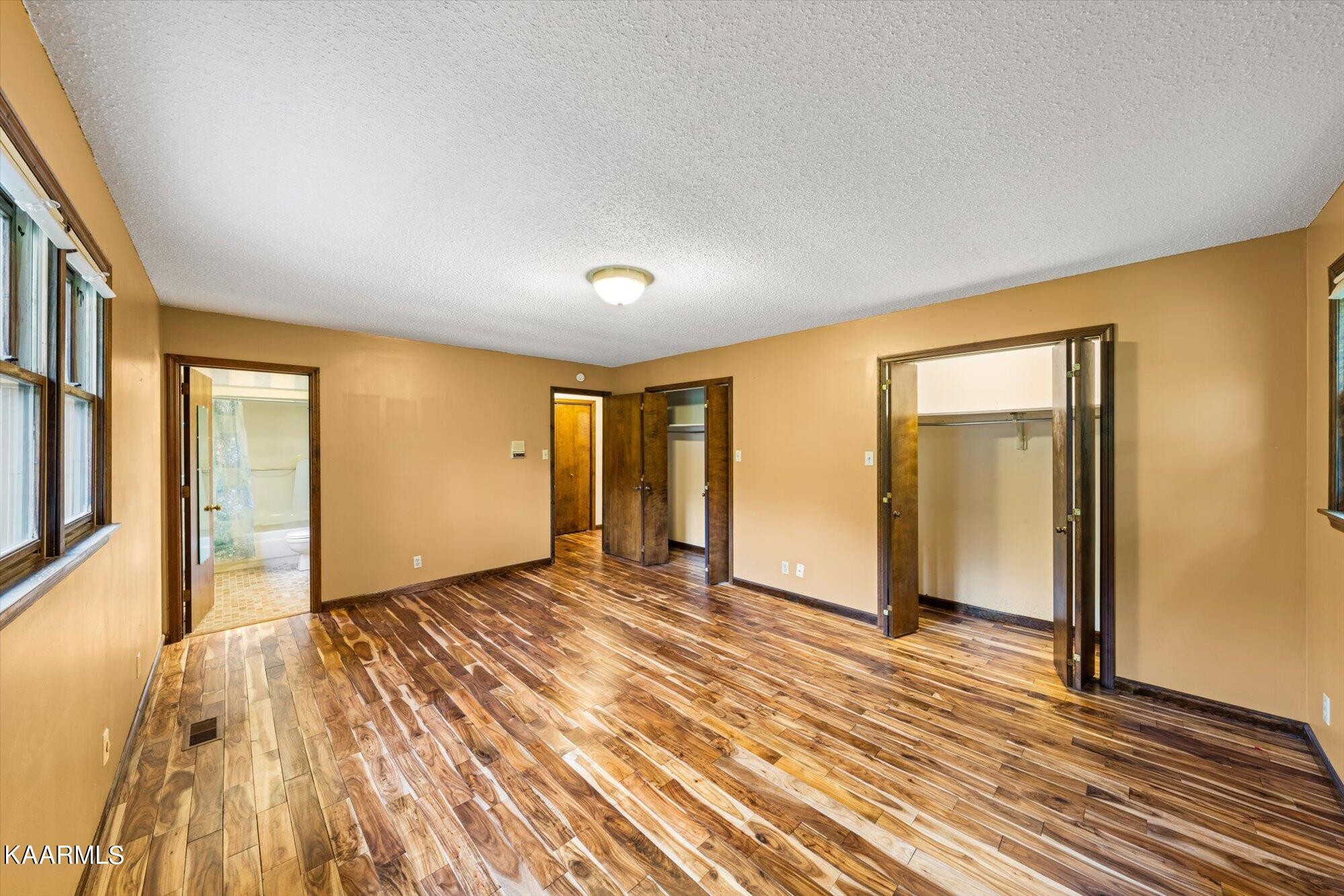 127 Chestnut Hill Road Oak Ridge, TN 37830 - Photo 21 of 45 a view of an empty room with wooden floor and a window