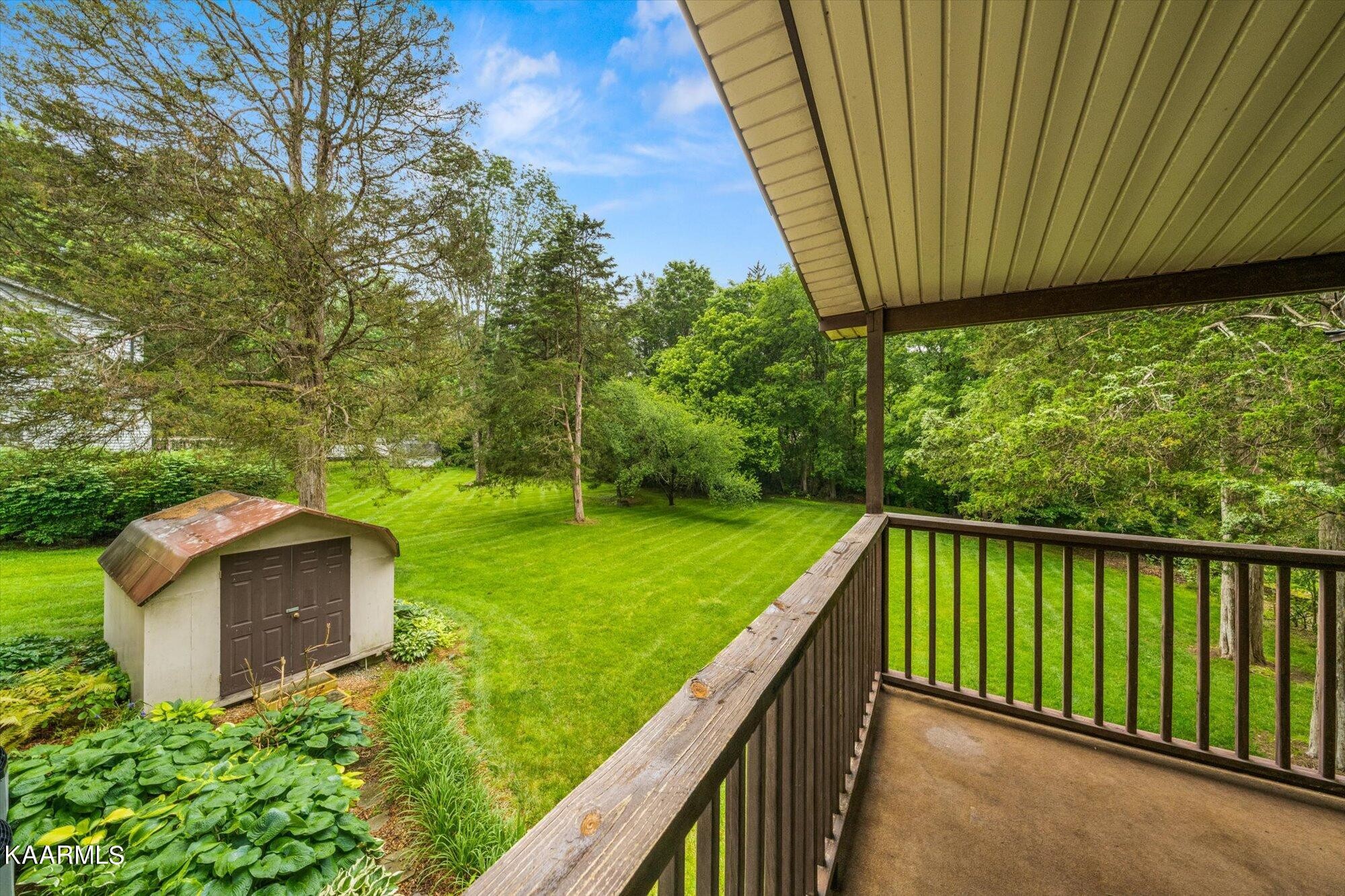 127 Chestnut Hill Road Oak Ridge, TN 37830 - Photo 35 of 45 a balcony with trees in the back