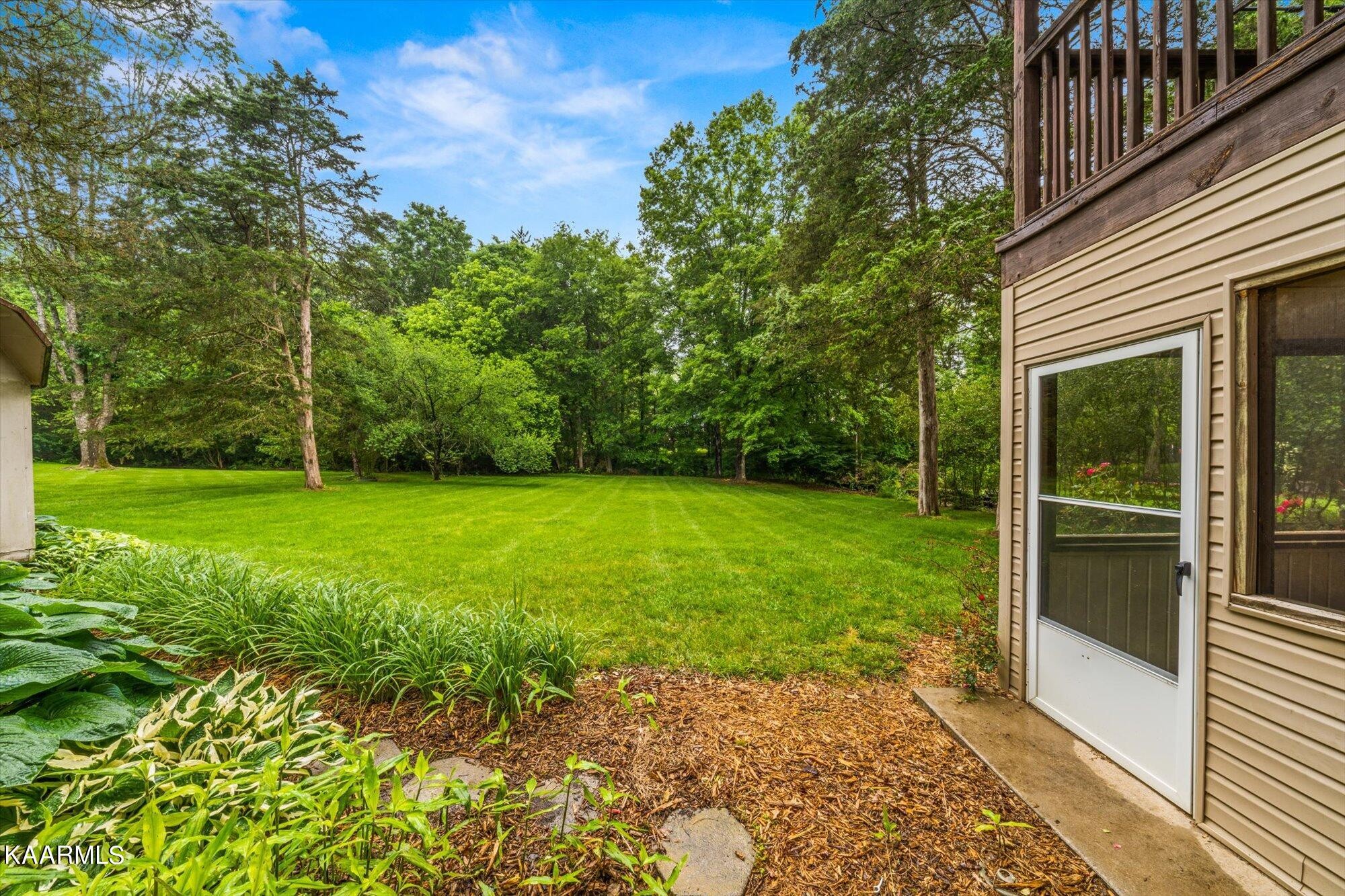 127 Chestnut Hill Road Oak Ridge, TN 37830 - Photo 38 of 45 a view of a backyard with a garden
