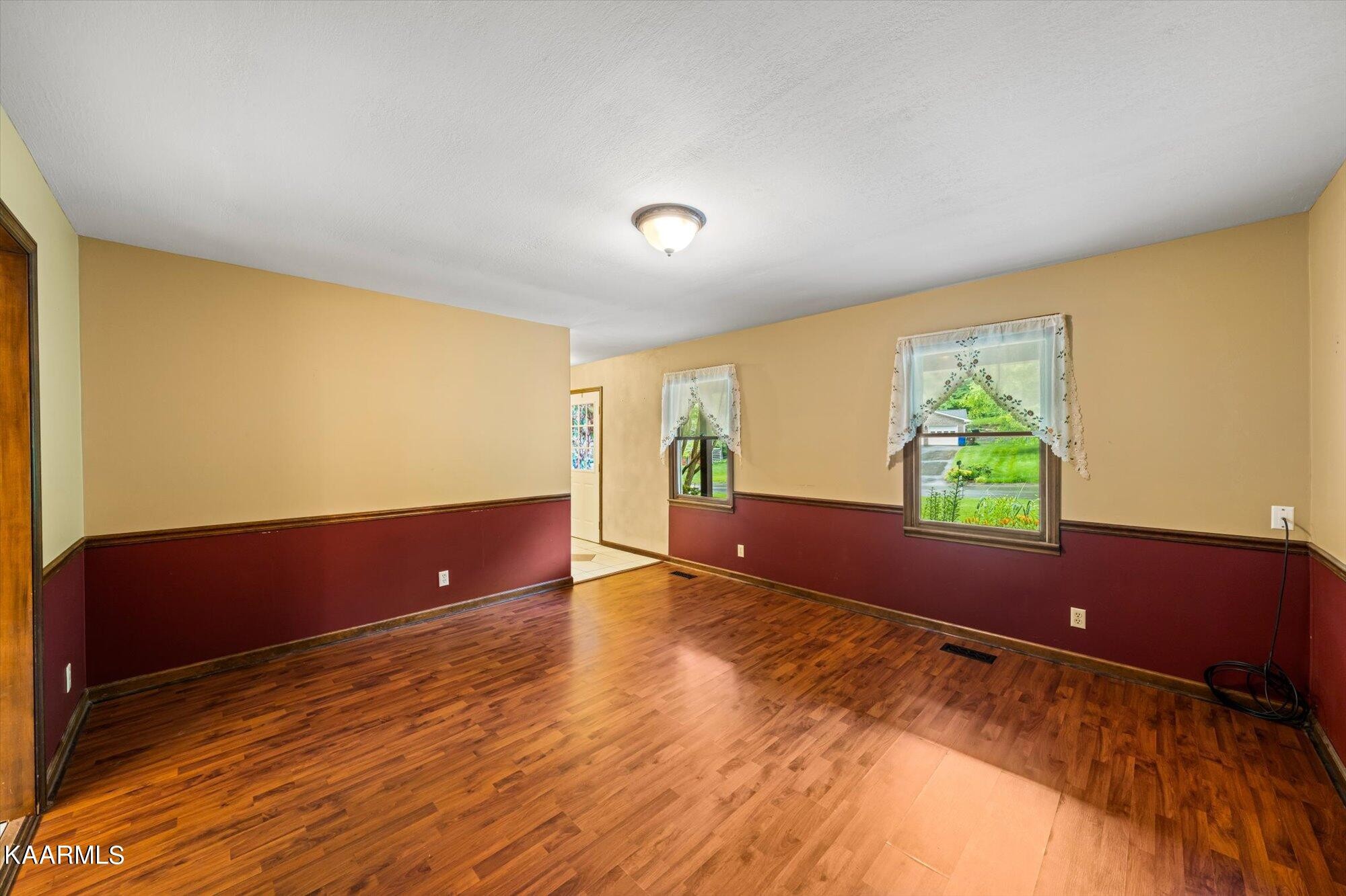 127 Chestnut Hill Road Oak Ridge, TN 37830 - Photo 41 of 45 wooden floor in an empty room with a window