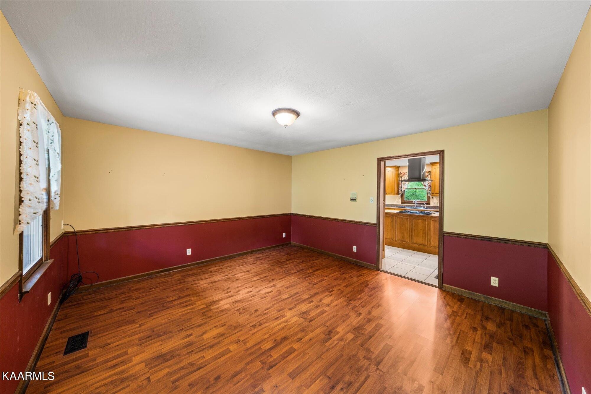 127 Chestnut Hill Road Oak Ridge, TN 37830 - Photo 42 of 45 a view of room with window and wooden floor