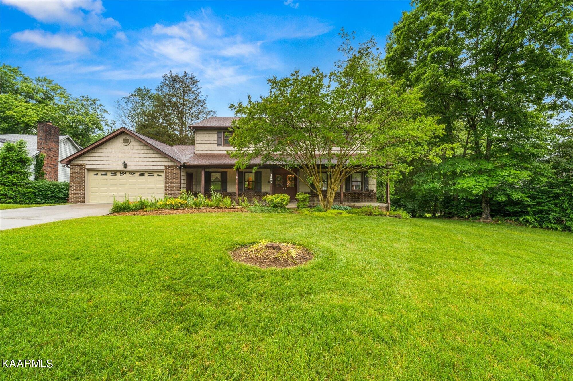 127 Chestnut Hill Road Oak Ridge, TN 37830 - Photo 43 of 45 a front view of a house with garden