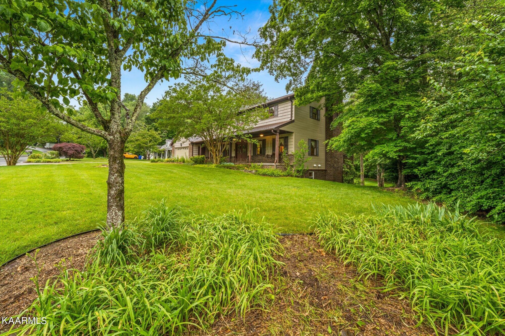 127 Chestnut Hill Road Oak Ridge, TN 37830 - Photo 44 of 45 front view of a house with a yard