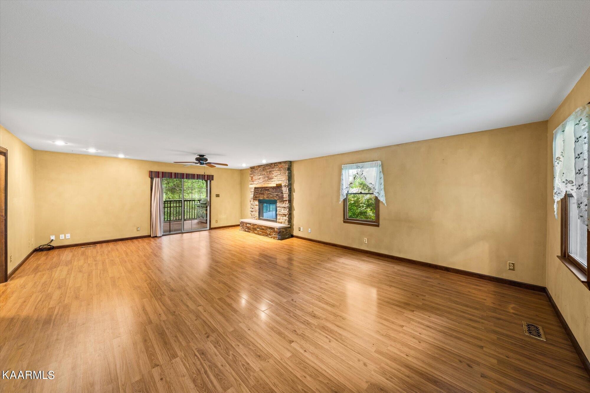 127 Chestnut Hill Road Oak Ridge, TN 37830 - Photo 7 of 45 a view of an empty room with wooden floor and a window