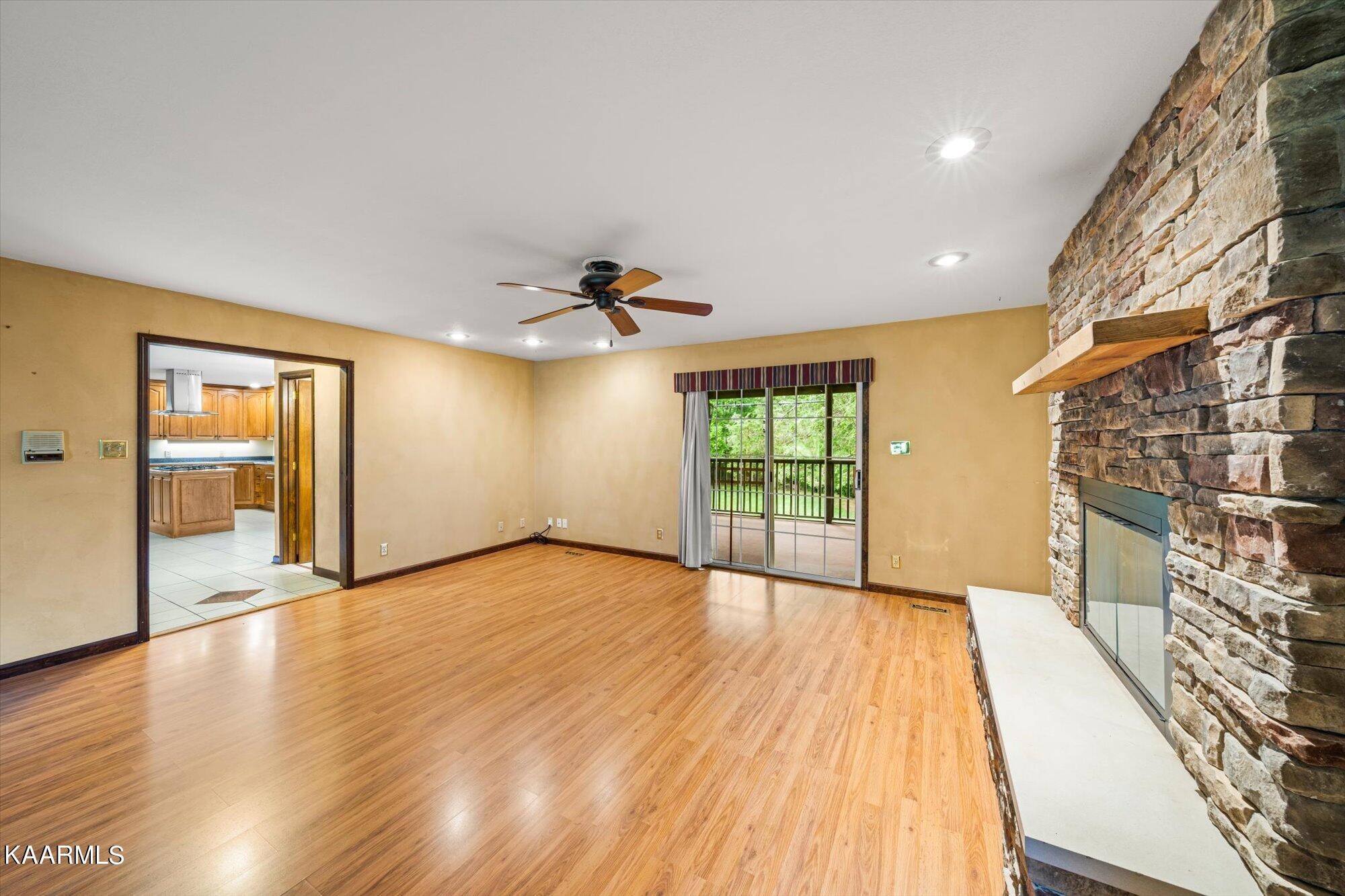 127 Chestnut Hill Road Oak Ridge, TN 37830 - Photo 10 of 45 a view of an empty room with wooden floor and a window