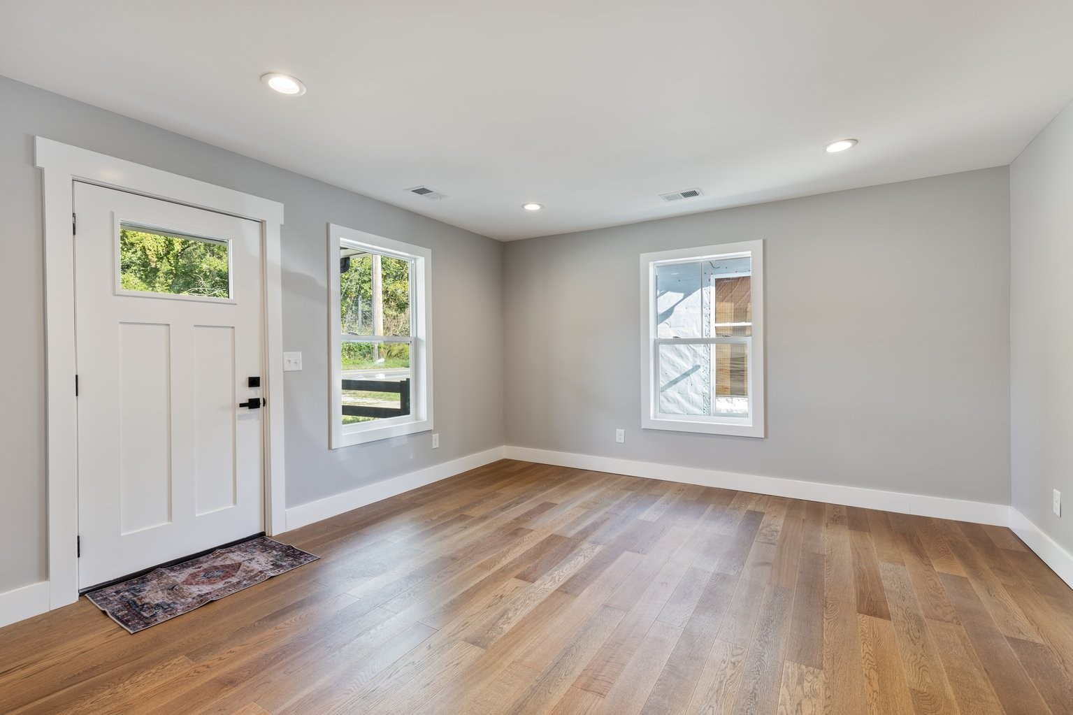 105 Pond Road Dickson, TN 37055 - Photo 3 of 13 a view of an empty room with wooden floor and a window