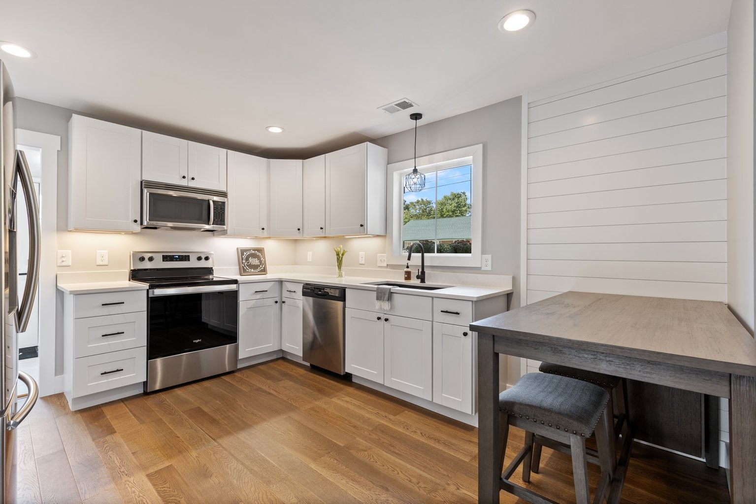 105 Pond Road Dickson, TN 37055 - Photo 5 of 13 a kitchen with a stove a sink and a refrigerator