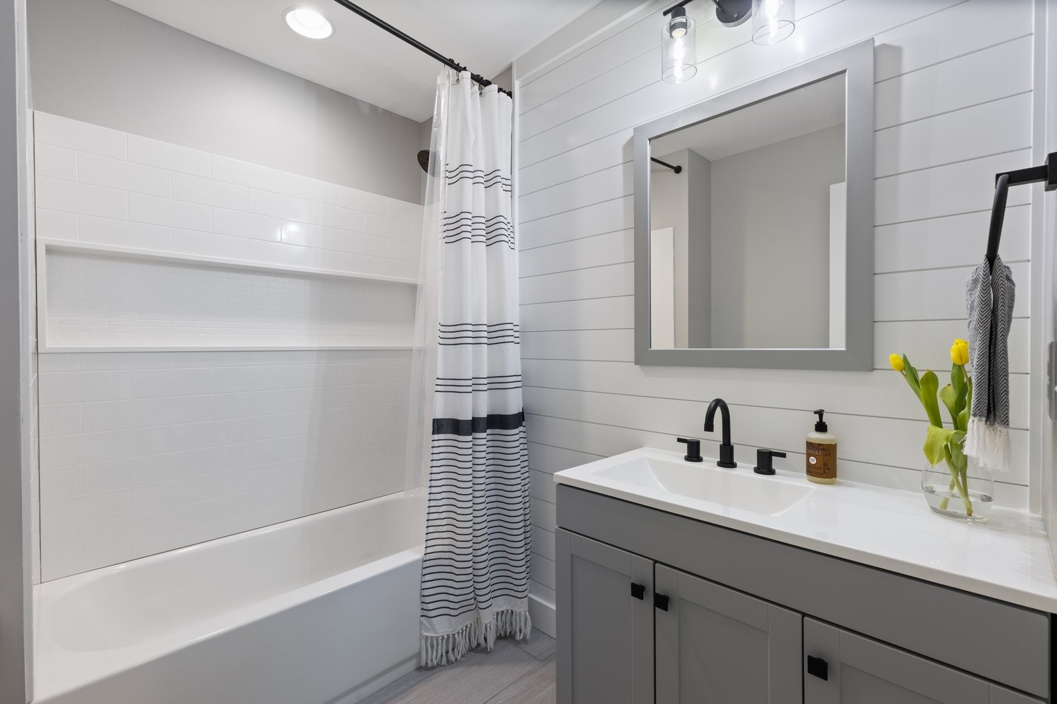 105 Pond Road Dickson, TN 37055 - Photo 7 of 13 a bathroom with a sink a mirror and a bathtub