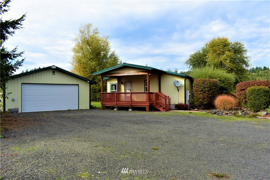 109 Faun Rae Lane Chehalis, WA 98532 - Photo 1 of 18 a house with trees in the background