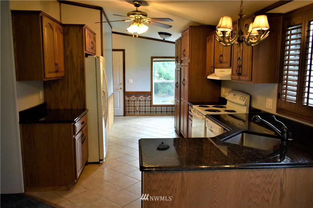 109 Faun Rae Lane Chehalis, WA 98532 - Photo 2 of 18 a kitchen with a sink appliances and cabinets