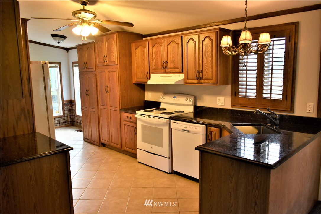 109 Faun Rae Lane Chehalis, WA 98532 - Photo 3 of 18 a kitchen with a sink appliances and cabinets