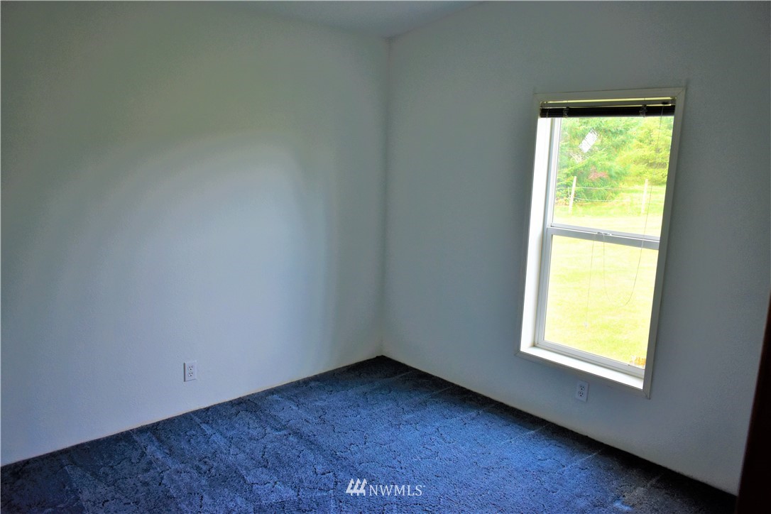 109 Faun Rae Lane Chehalis, WA 98532 - Photo 4 of 18 a view of an empty room and a window