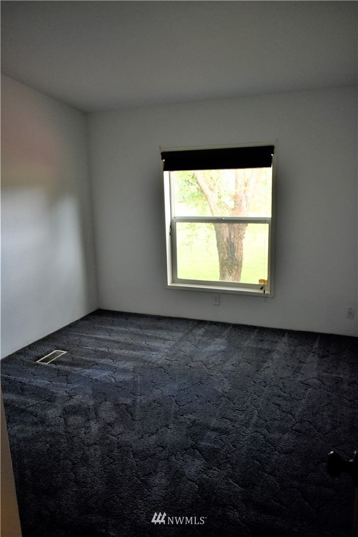109 Faun Rae Lane Chehalis, WA 98532 - Photo 5 of 18 a view of an empty room and window