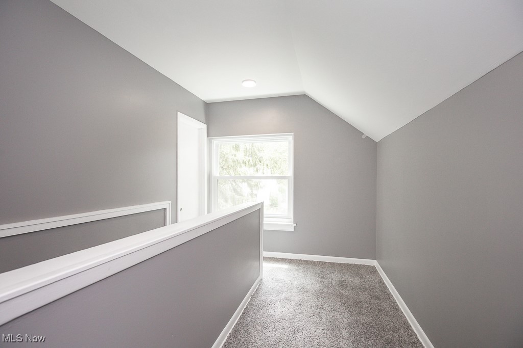 1547 Genesee Road South Euclid, OH 44121 - Photo 23 of 36 Additional living space with carpet flooring, vaulted ceiling, and baseboards