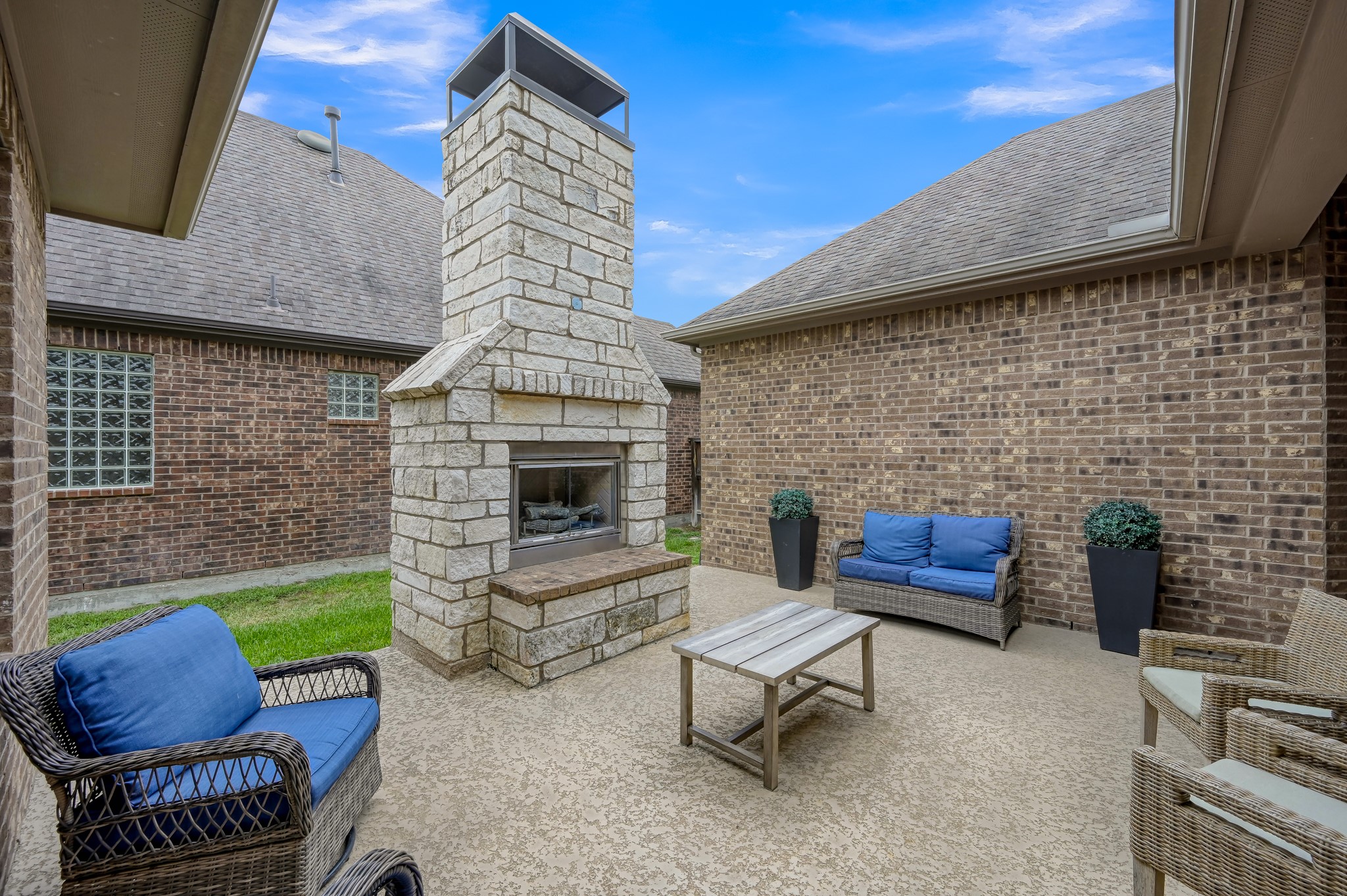 31714 Pierwood Court Spring, TX 77386 - Photo 7 of 49 a outdoor living space with furniture and a fireplace