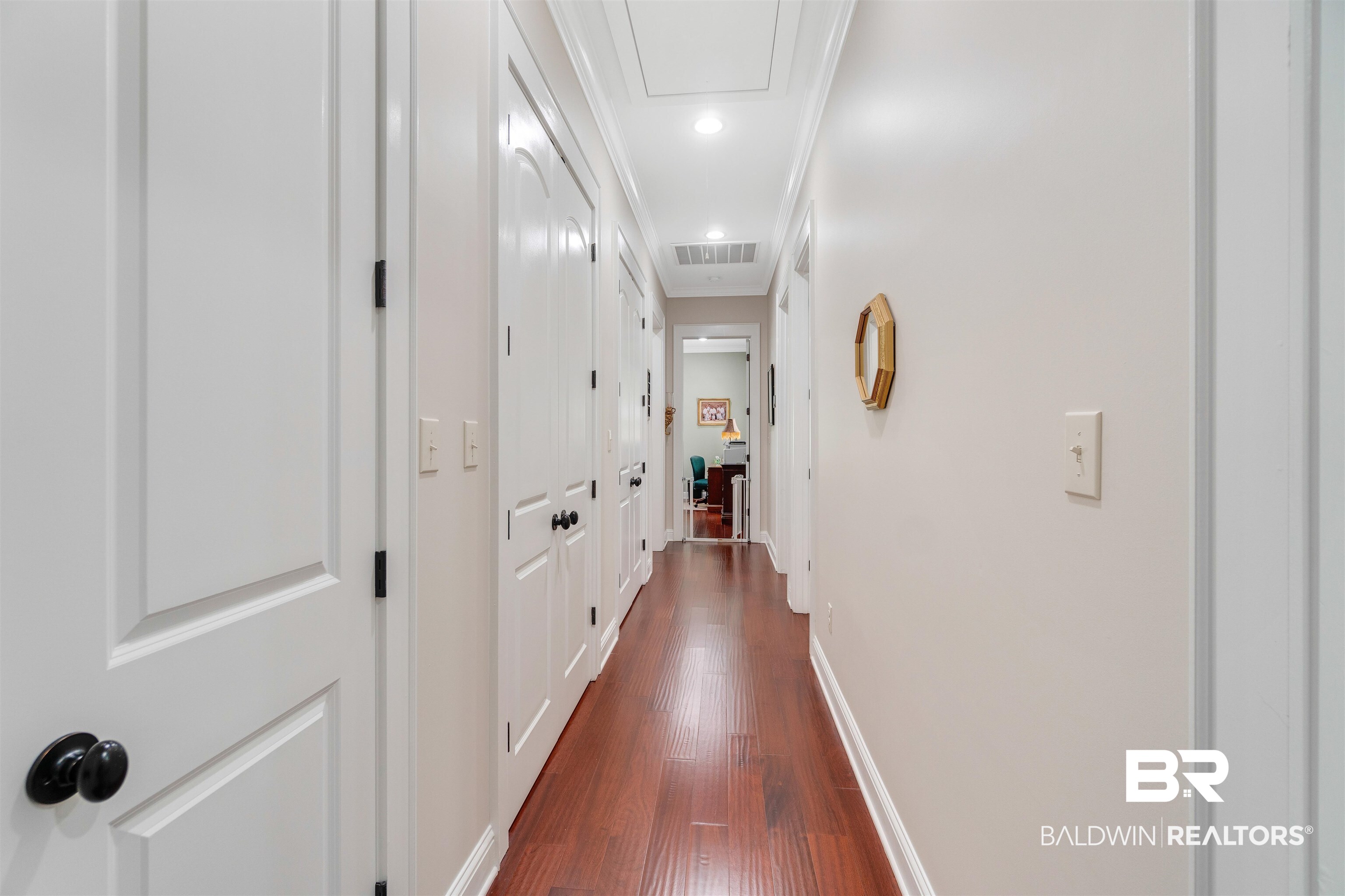 11281 Redfern Road Daphne, AL 36526 - Photo 53 of 80 Hallway featuring crown molding and dark wood-type flooring