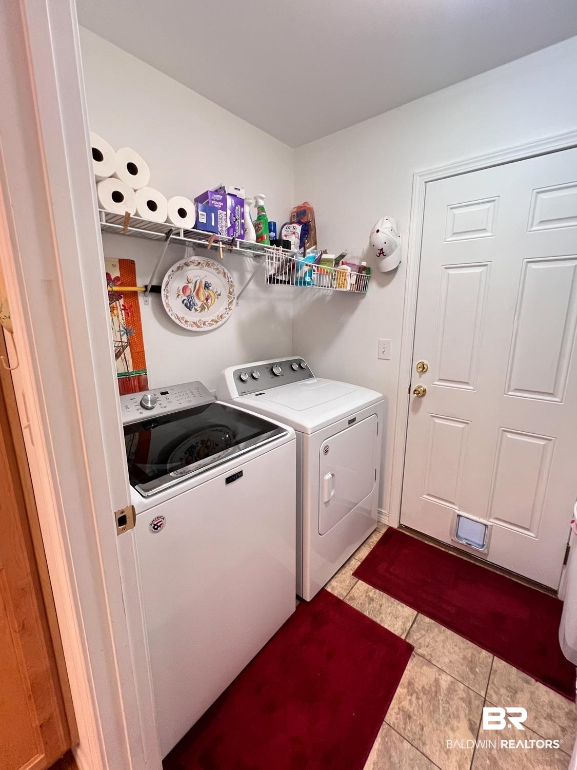 16690 Plum Court Loxley, AL 36551 - Photo 22 of 30 Laundry area featuring separate washer and dryer and light tile patterned floors