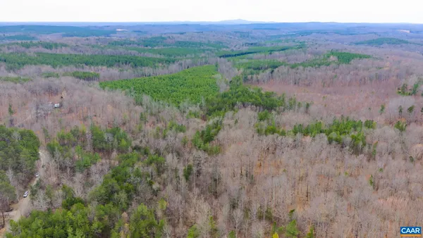 a view of a yard with a table and a chair