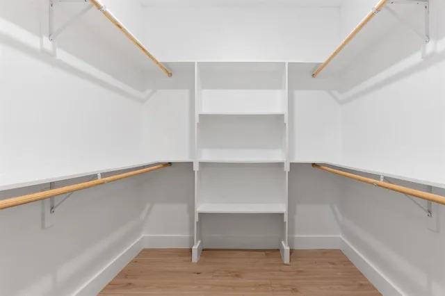 a view of an empty walk in closet