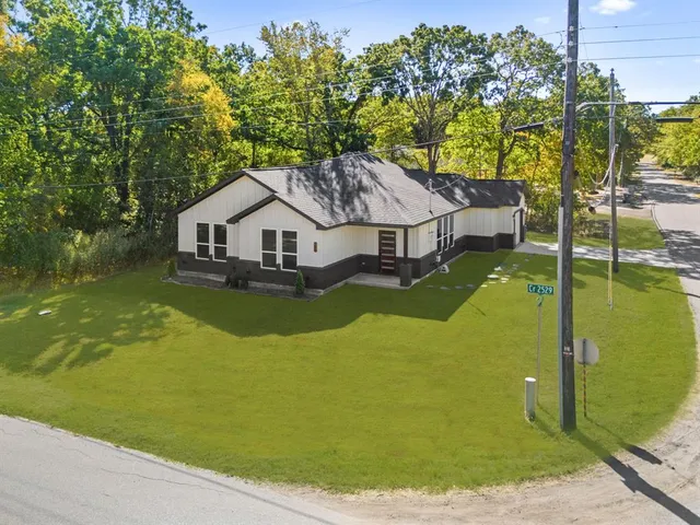 a house with swimming pool in front of it