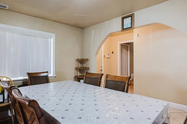 a view of a dining room with furniture