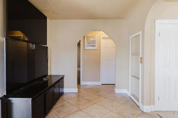a view of a dining room with furniture and windows