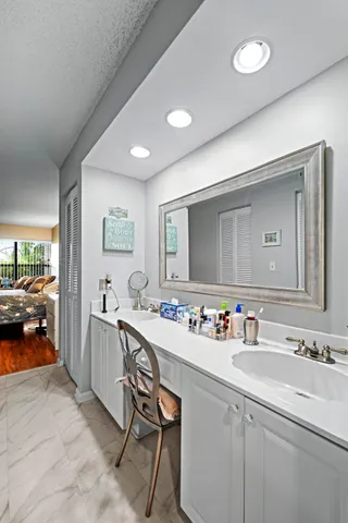 a bathroom with a sink double vanity and a mirror
