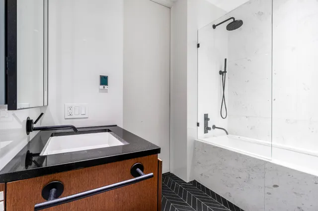 a bathroom with a bathtub and a sink