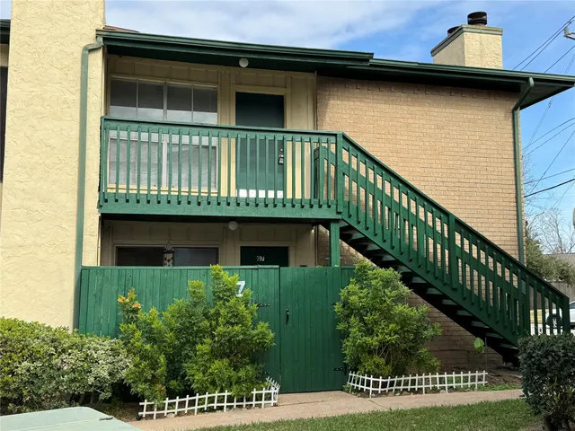 a view of a house with a small yard