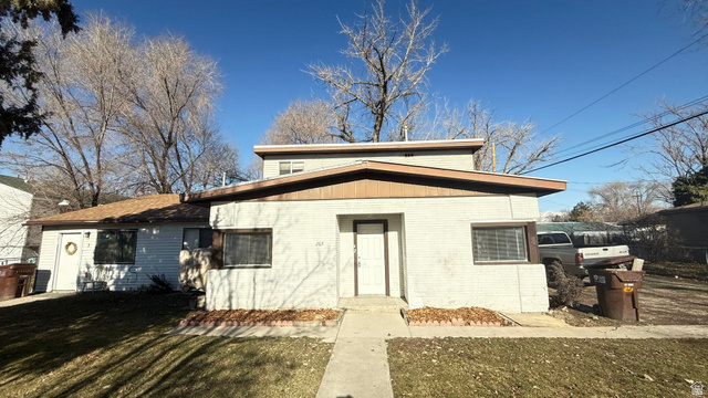 265 Rigdon Avenue, Unit 1 Salt Lake City, UT 84115 - Photo 1 of 15 White exterior with contrasting brown trim