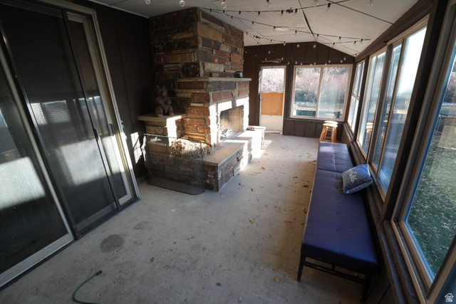 3711 North Canyon Road Provo, UT 84604 - Photo 33 of 42 Sunroom / solarium featuring unfinished concrete flooring and wooden walls
