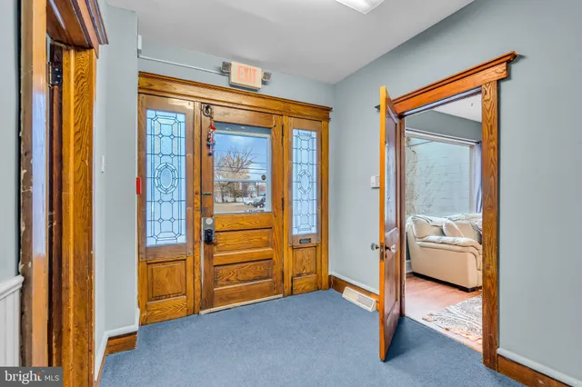 a view of an empty room and bathroom